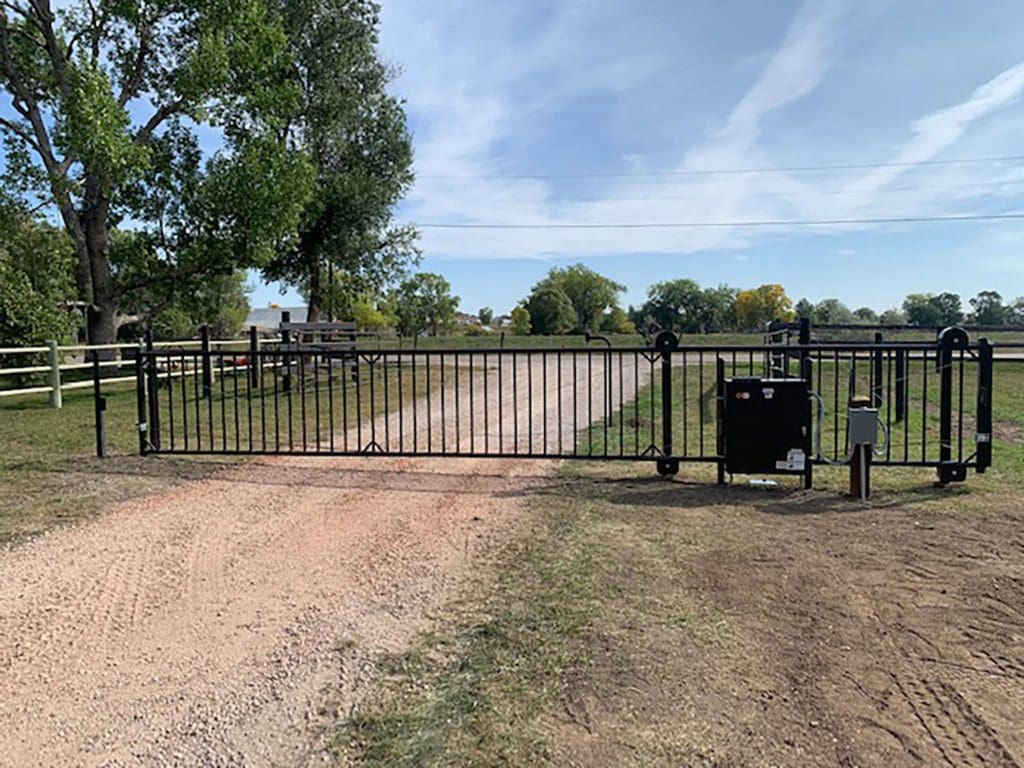 Black Residential security gate installed in driveway during Residential Access Control Project